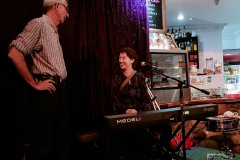 Tim and Cindy talking pianos.